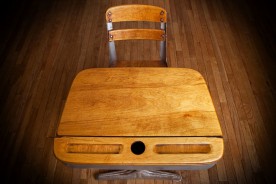 a vintage wooden school desk and chair